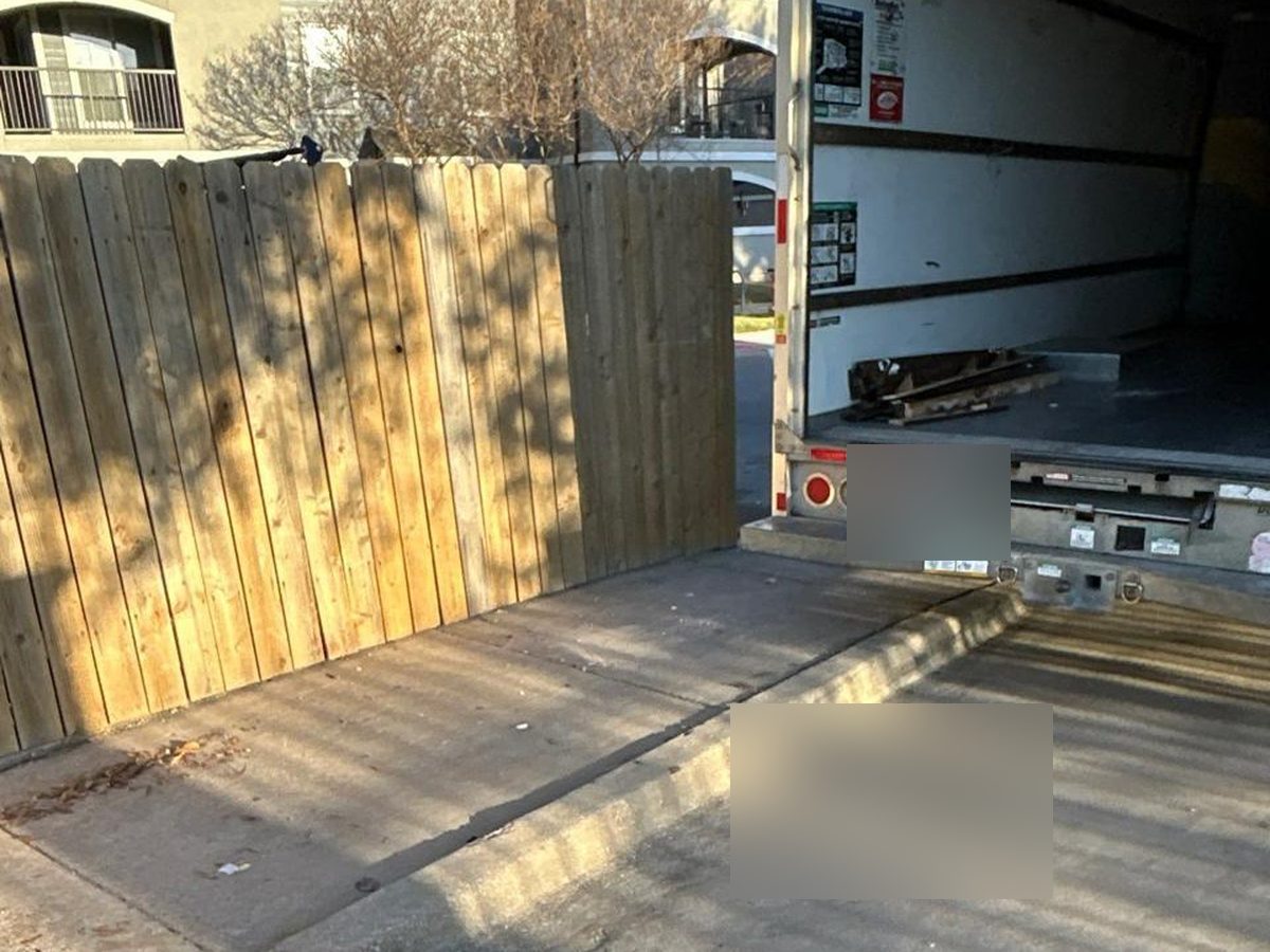 After bulk furniture removal showing cleared apartment driveway area