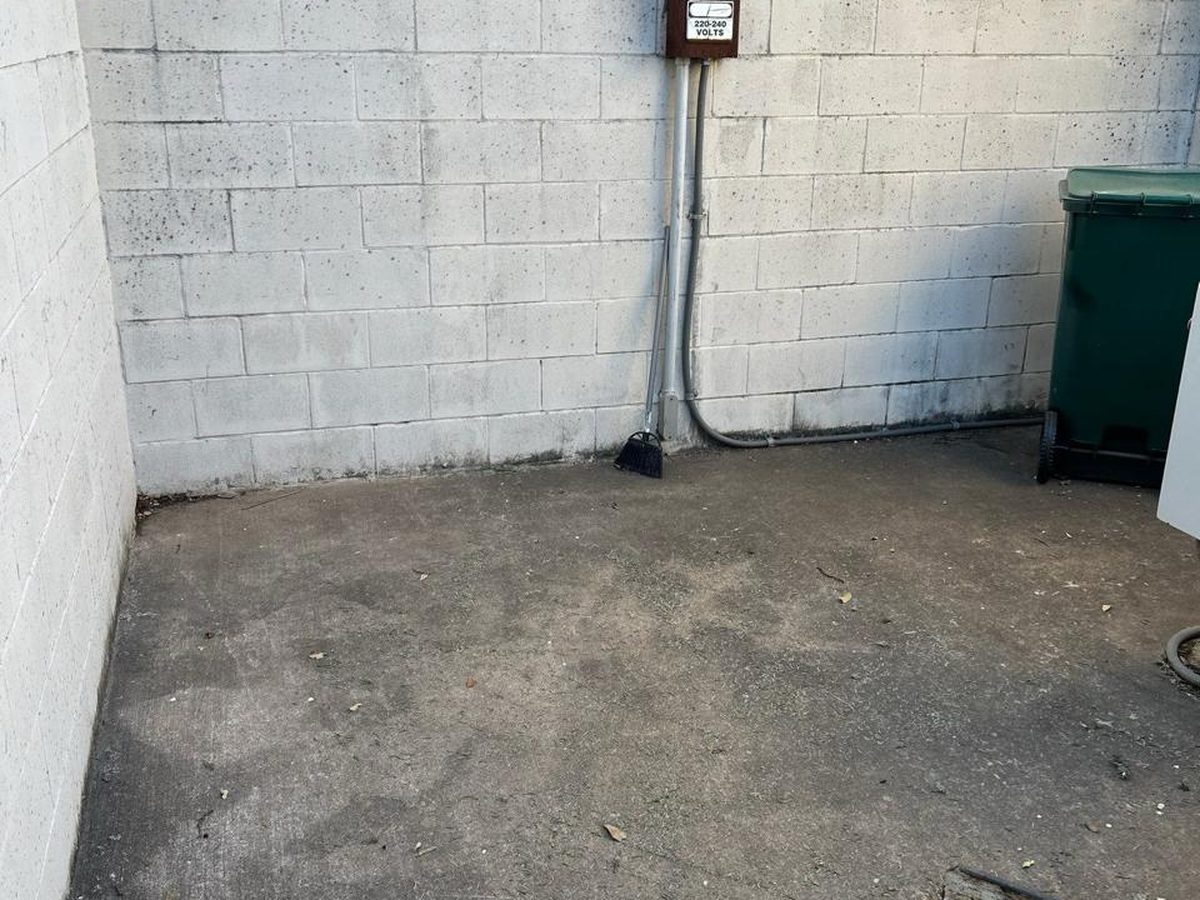 After patio cleanout showing cleared concrete patio space